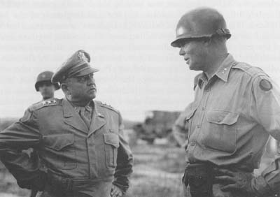 General Walker (left) is greeted on arrival at Taejon by General Dean.